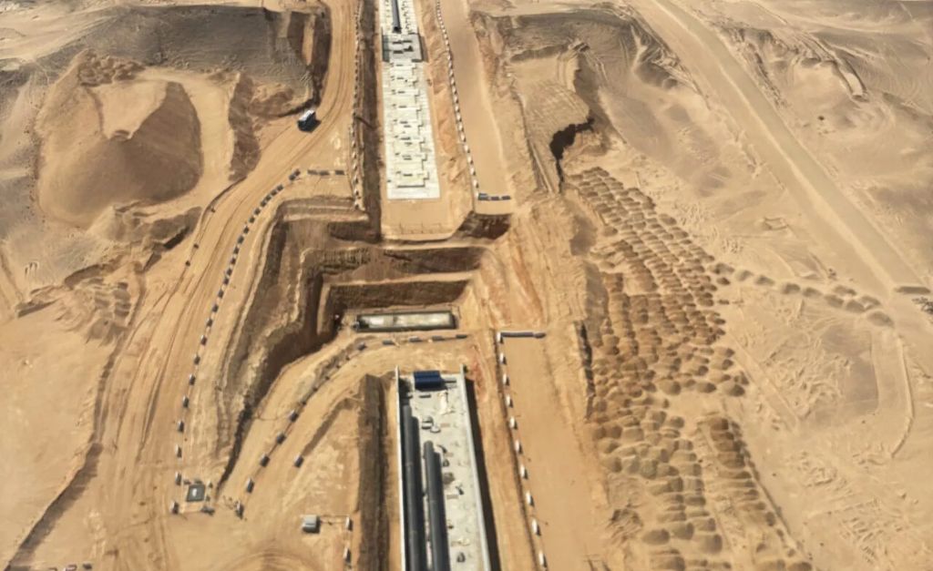 Aerial view of an industrial facility under construction in the desert